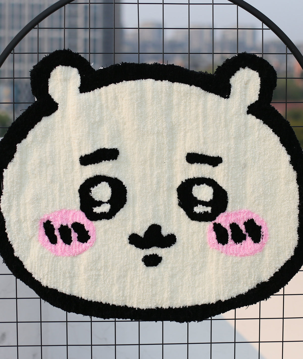 Close-up of the Chiikawa rug texture, showing tufted cream fur, pink cheeks, and detailed face