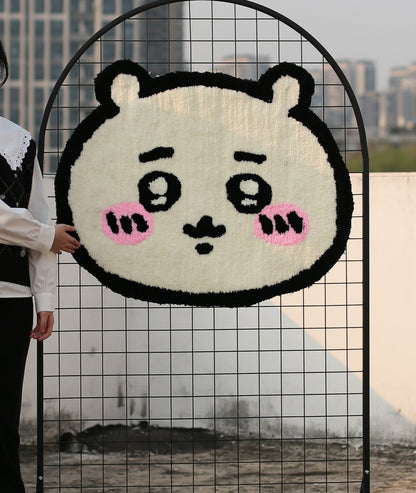 Chiikawa character rug held up to show the cute bear face, soft high-density acrylic yarn tufting