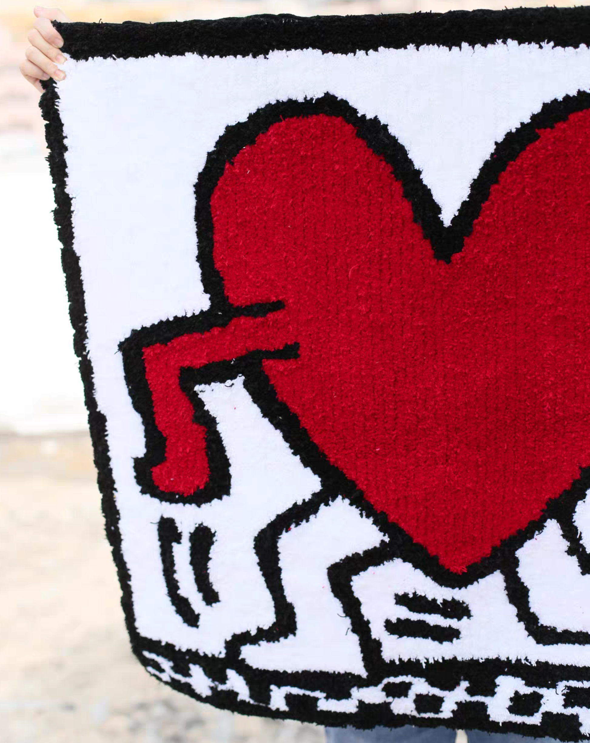 Keith Haring heart rug edge detail hand tufted bold red white bedroom floor decor