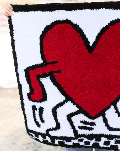 Keith Haring heart rug edge detail hand tufted bold red white bedroom floor decor