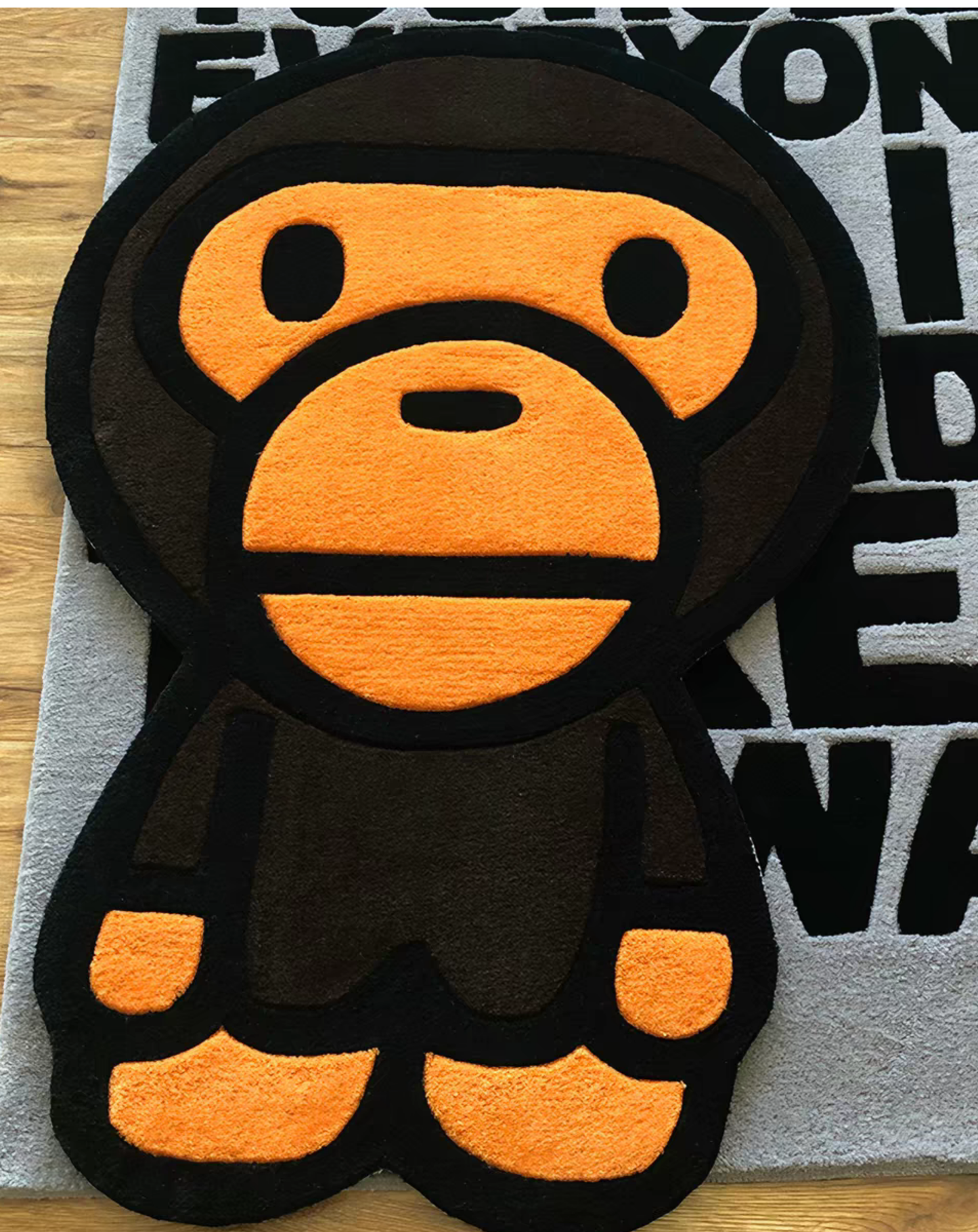 Baby Milo Ape Head tufted rug for room aesthetic. Premium hand-tufted Bape carpet in living room. Urban street style interior design floor decor.