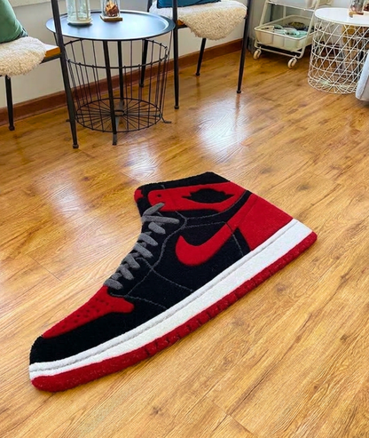 Shoe shaped rug in black red and white on hardwood, plush acrylic pile, living room view