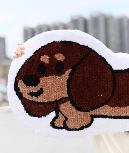 Close up of the dog rug face, brown and tan tufted yarn with a cream border, detail view