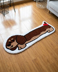 Dachshund shaped dog rug on a wood floor, hand tufted brown and cream pile, full top view
