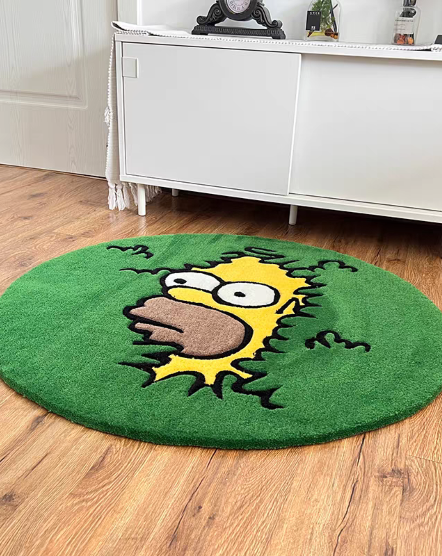 Homer bush rug angle view round hand tufted green acrylic pile detail