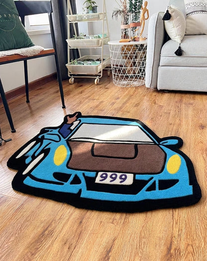 Gaming room rug shaped like a blue car with 999 plate, styled in a living room next to a sofa and chair