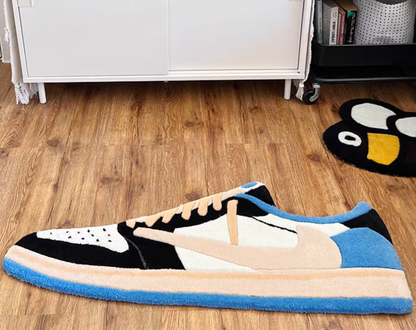 Travis Scott Fragment Jordan 1 Low Military Blue rug on floor. Nike Air Jordan 1 OG SP black white blue handmade tufted carpet. Sneakerhead hypebeast bedroom gaming room sneaker decor.