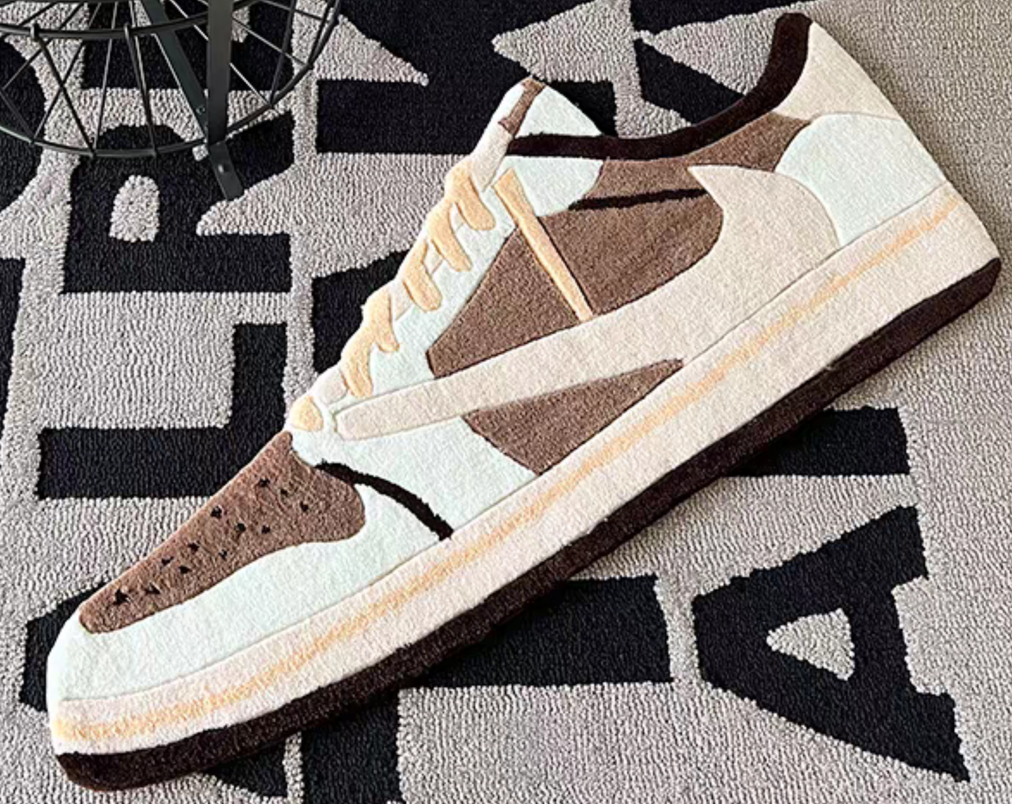 Travis Scott Jordan 1 Low Mocha rug on wooden floor in bedroom. Nike Air Jordan 1 OG SP Cactus Jack brown sail nubuck handmade tufted carpet. Sneakerhead hypebeast gaming setup room decor.