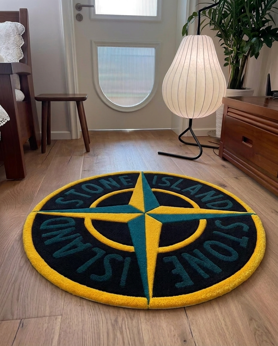 A round black, yellow, and teal  rug featuring the Stone Island compass design, placed on a light wood floor in a modern room setting.