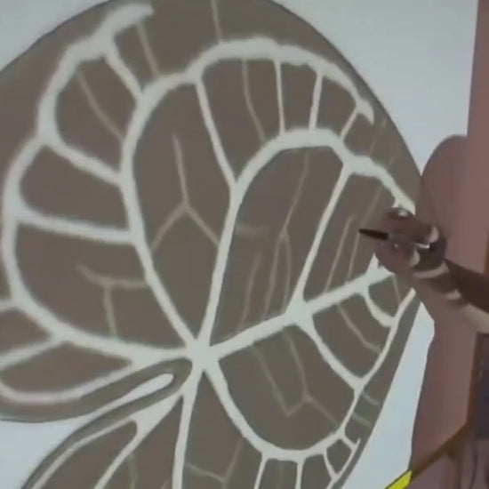 Video of the leaf rug being hand tufted, design outline on the frame during making