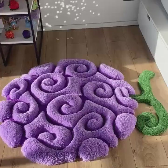 Purple swirl fruit rug video, soft tufted acrylic pile with green stem, bedroom floor view