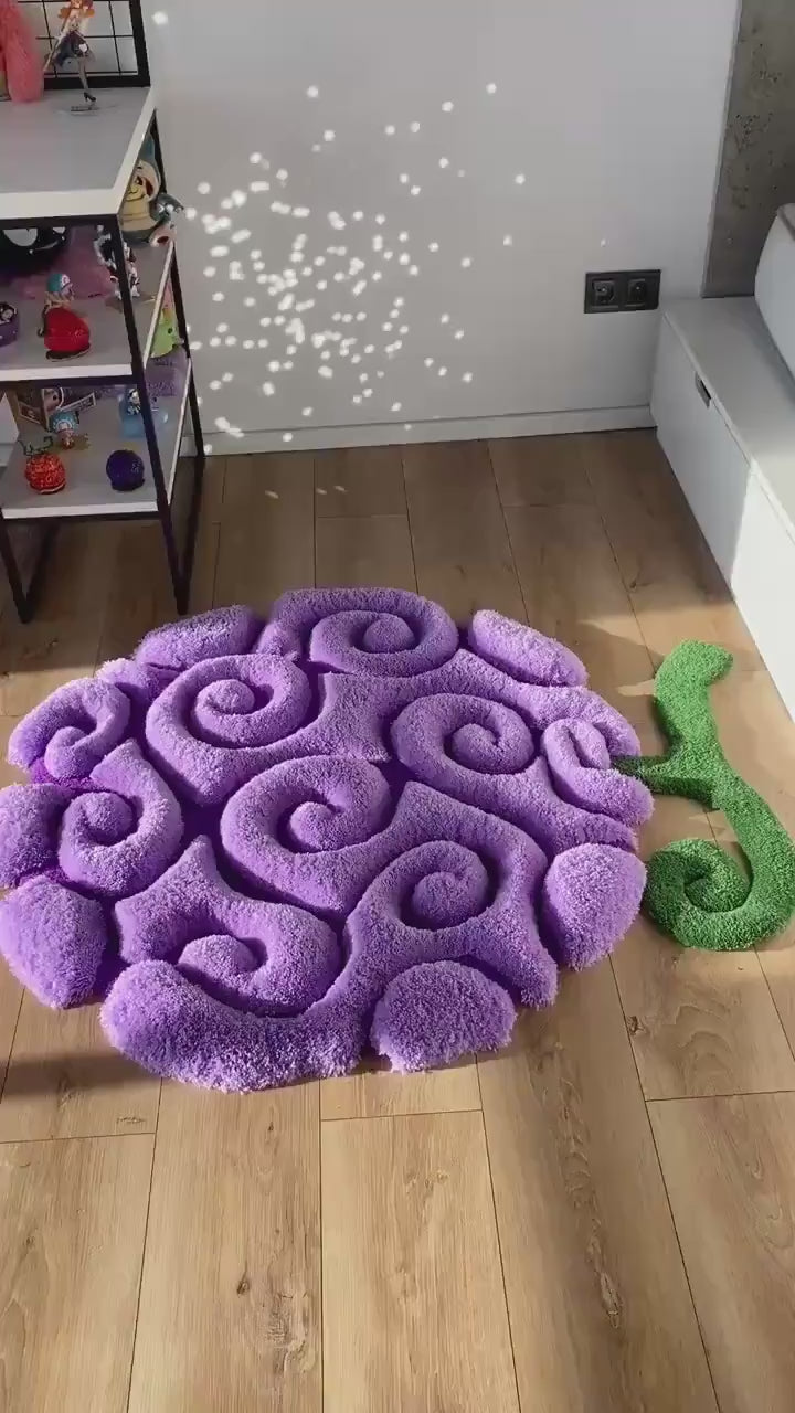 Purple swirl fruit rug video, soft tufted acrylic pile with green stem, bedroom floor view