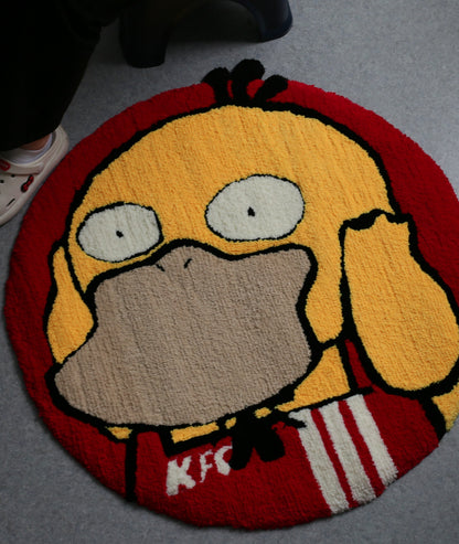 Close-up of the Psyduck rug texture, showing tufted yellow character and bold red border ring